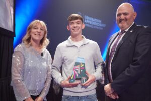 Pictured: Lucan native, Cian O'Callaghan (Go Ahead Ireland, Naas) is pictured accepting his Apprentice of the Year Award for the Motor category, from NAO Director Mary Liz Trant and Barry Commerford at the 2024 Awards Ceremony.